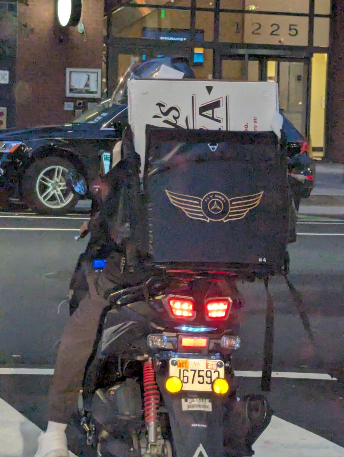 Delivering pizza on a moped that has no space to carry it horizontally should be a crime