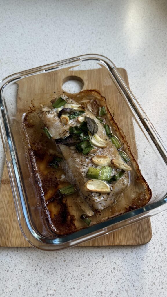 Oven-baked, soy-glazed haddock with garlic, spring onions, and air-fried carrots