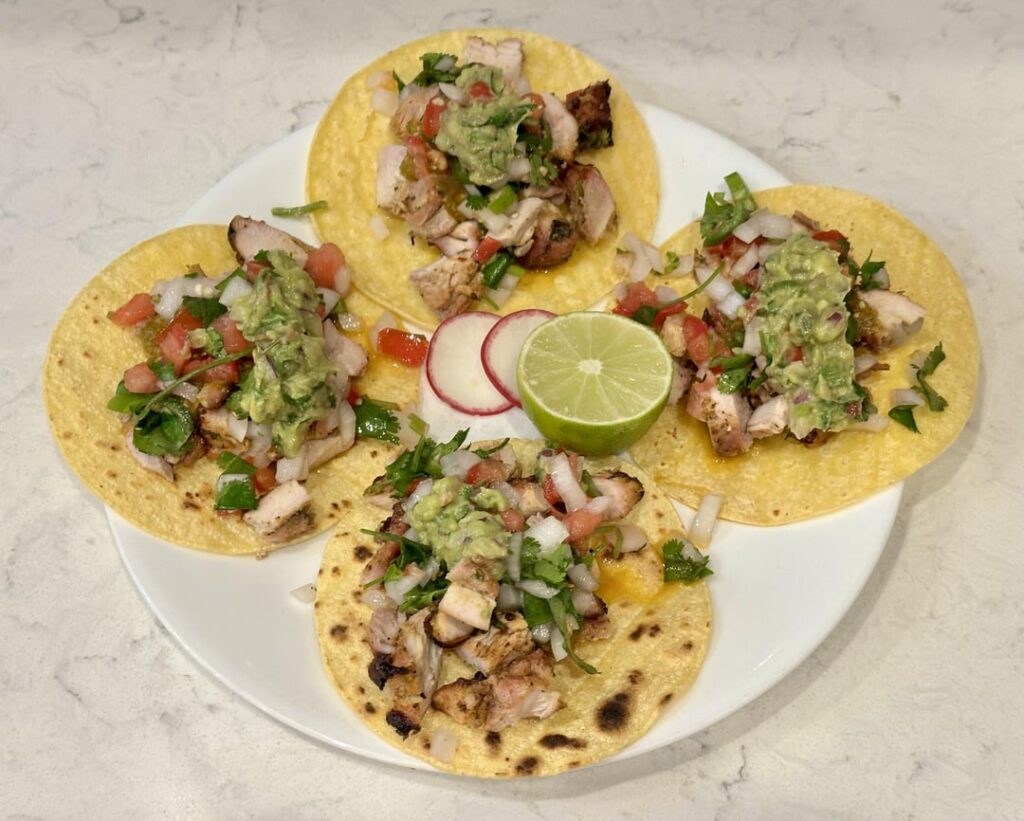 Pollo Asado tacos with roasted habanero salsa, guacamole, and pico de gallo