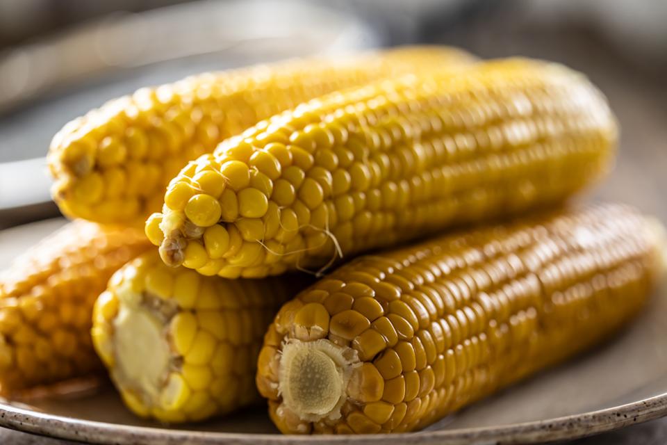 Sweet corn cooked until golden with steam rising.