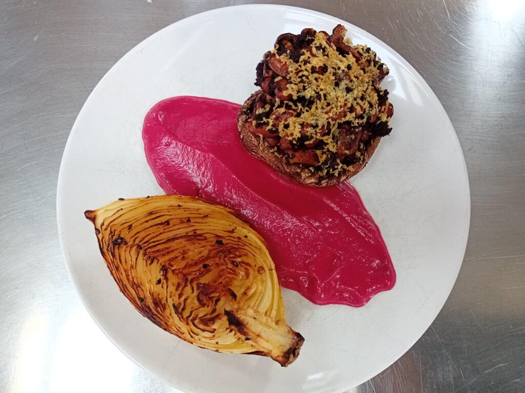 Portobello filled with mushroom and beans with cabbage and beet spread