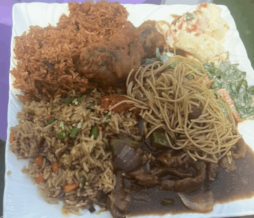 Ghanaian jollof rice, fried rice, mixed vegetables, coleslaw, spaghetti and fried chicken ~ Accra, Ghana
