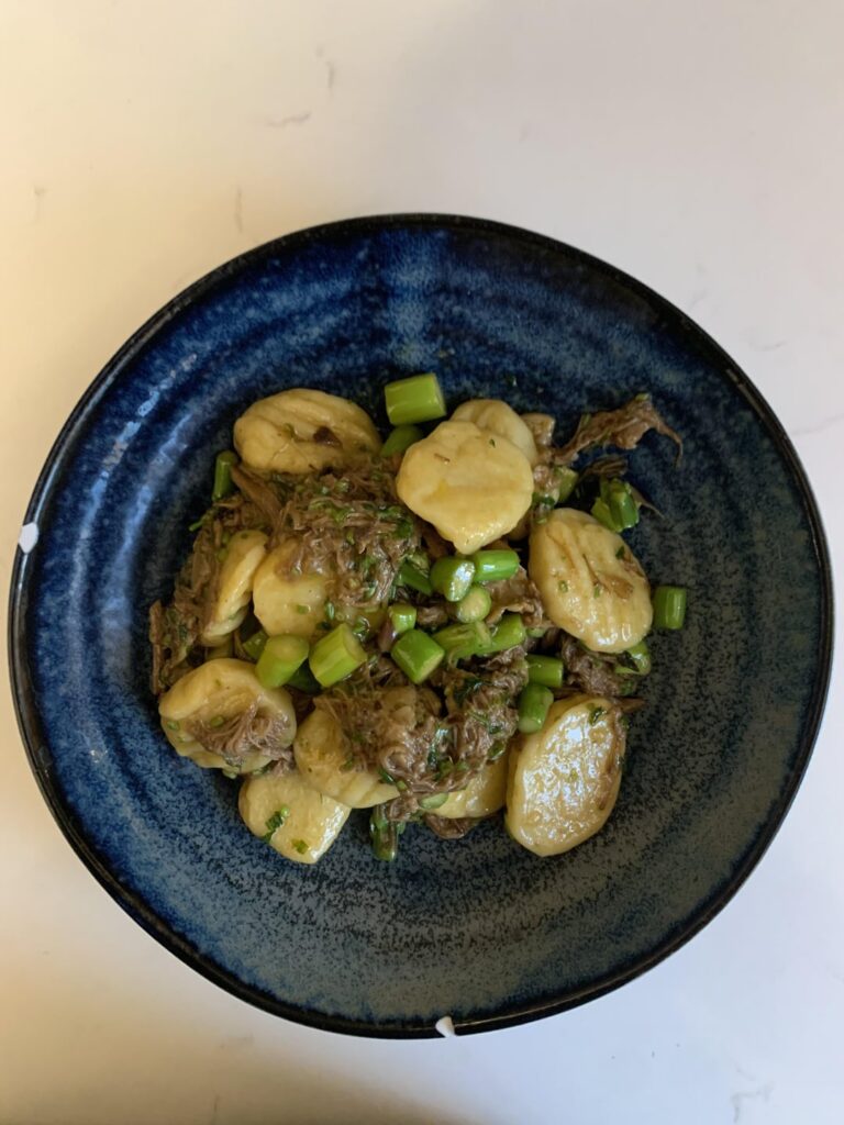 Gnocchi with lamb, asparagus and parsley
