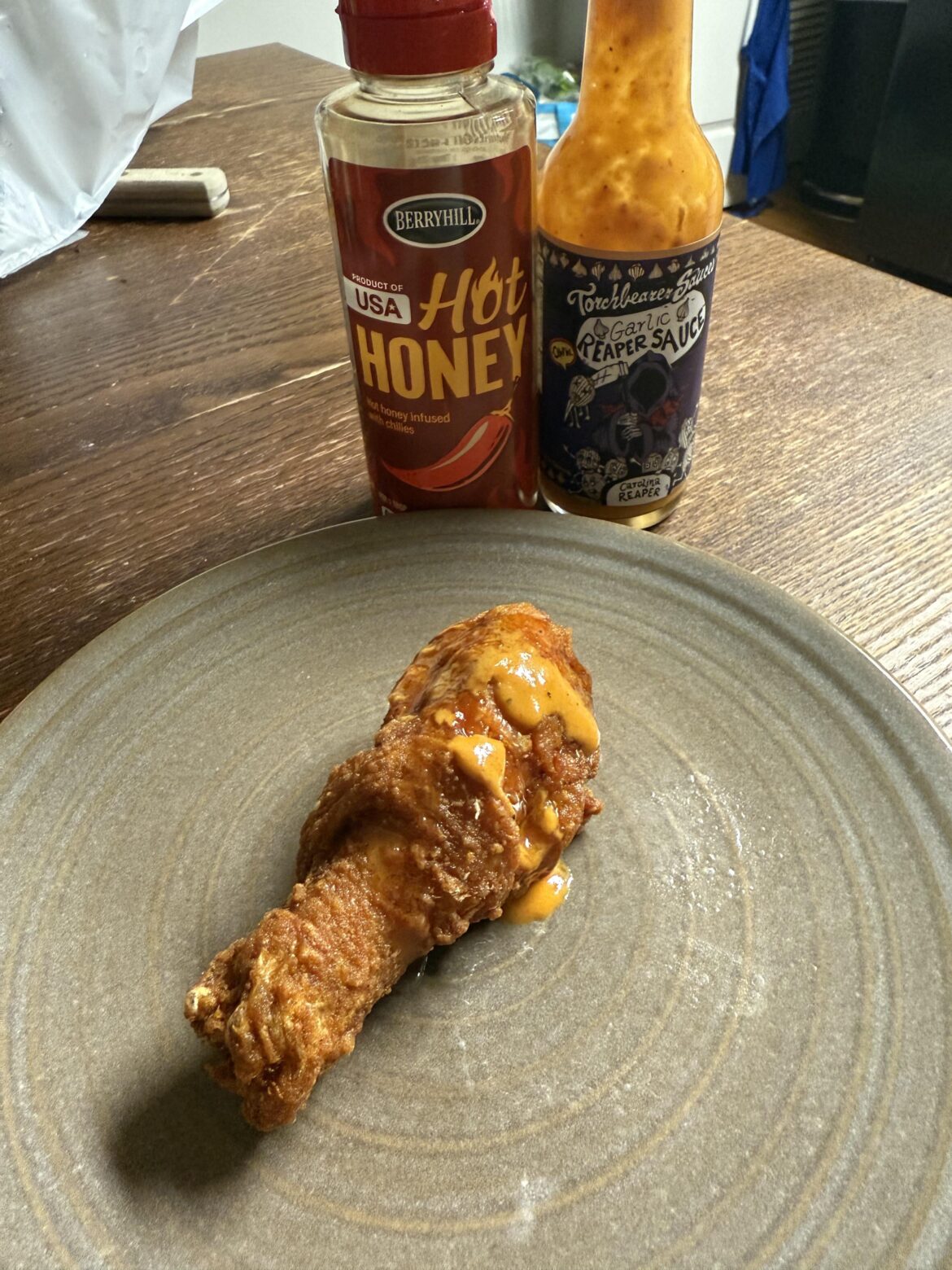 Gus’ fried chicken with hot honey and Torchbearer garlic reaper