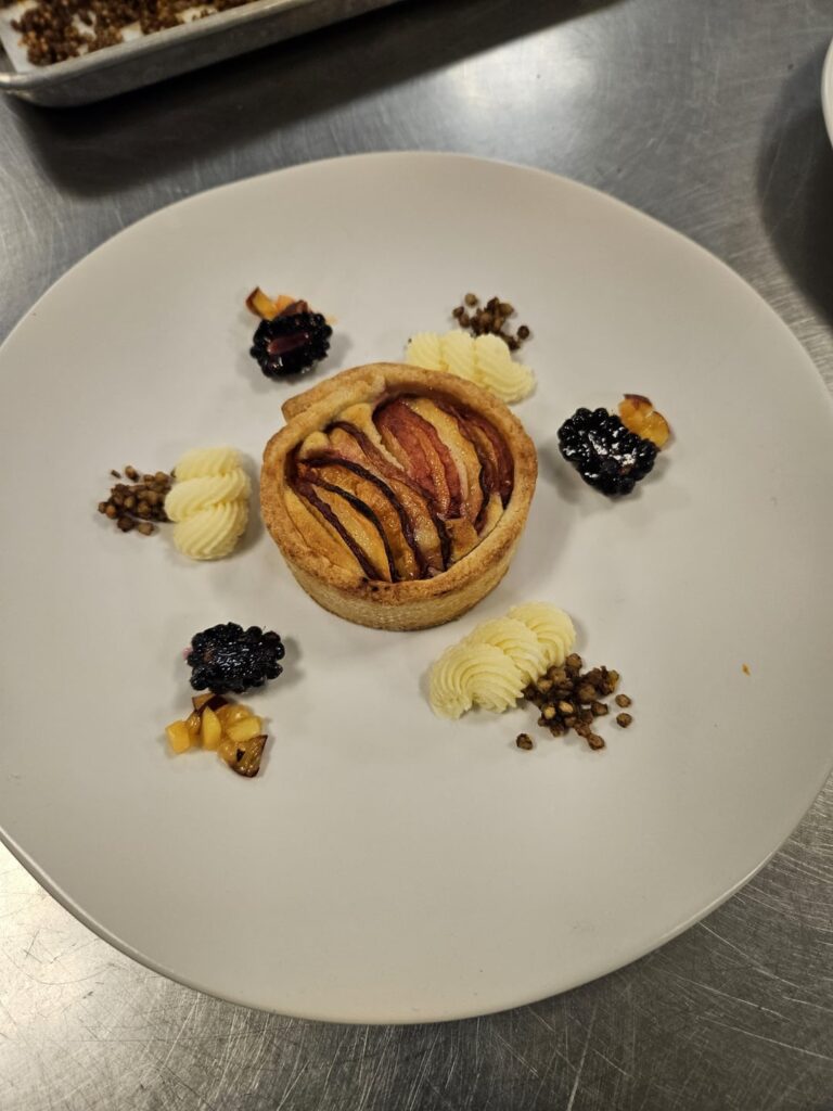 Peach Frangipane Tartlet with Vanilla Bean Creme Diplomat, Macerated Blackberries, and Cinnamon Sugar Buckwheat Groats