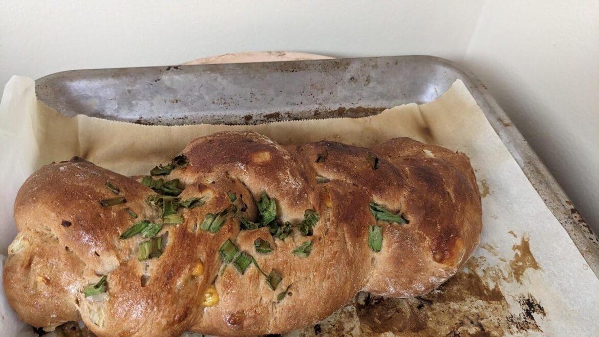 Challah with chopped onion and cheddar cheese. Topped with green onions. THe whole house smells delicious.