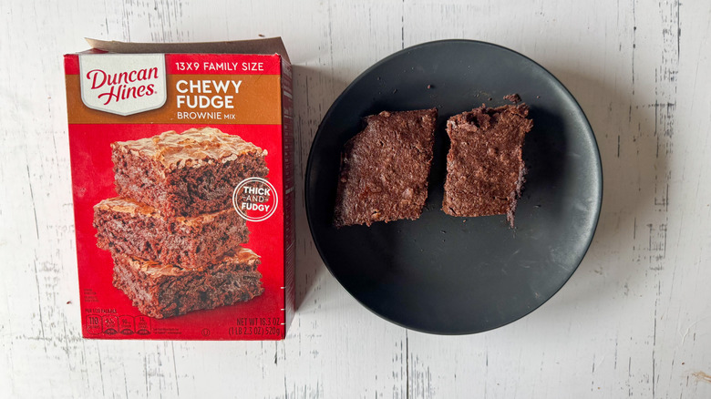 Duncan Hines brownie mix on a white surface