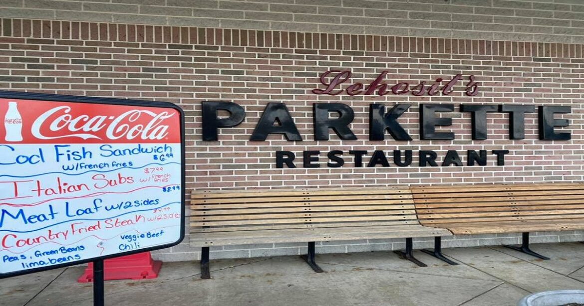 View of Charleston, West Virginia, including the river and capital building on a sunny day