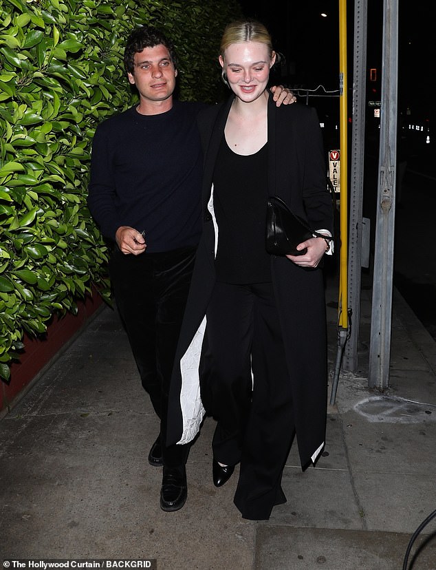 The loved up couple held hands as they exited the Italian eatery. The Maleficent star, 27 looked beautiful in a scoop neck black top with black pants and a long black coat