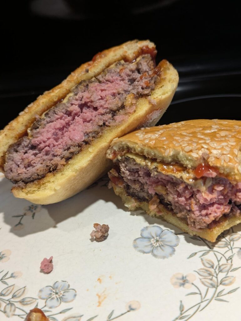 A simple yummy cheeseburger on a brioche bun.