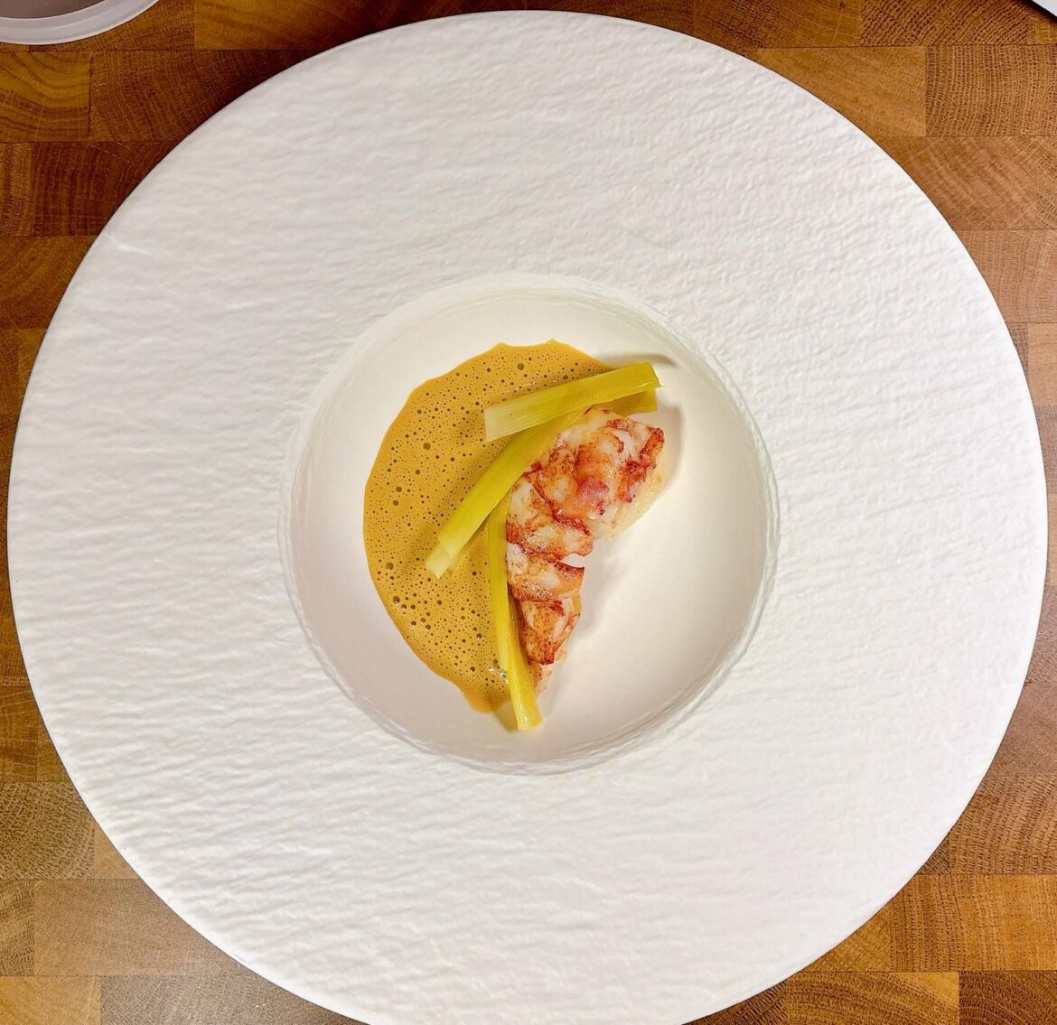 Poached lobster tail, confit leeks, uni bisque