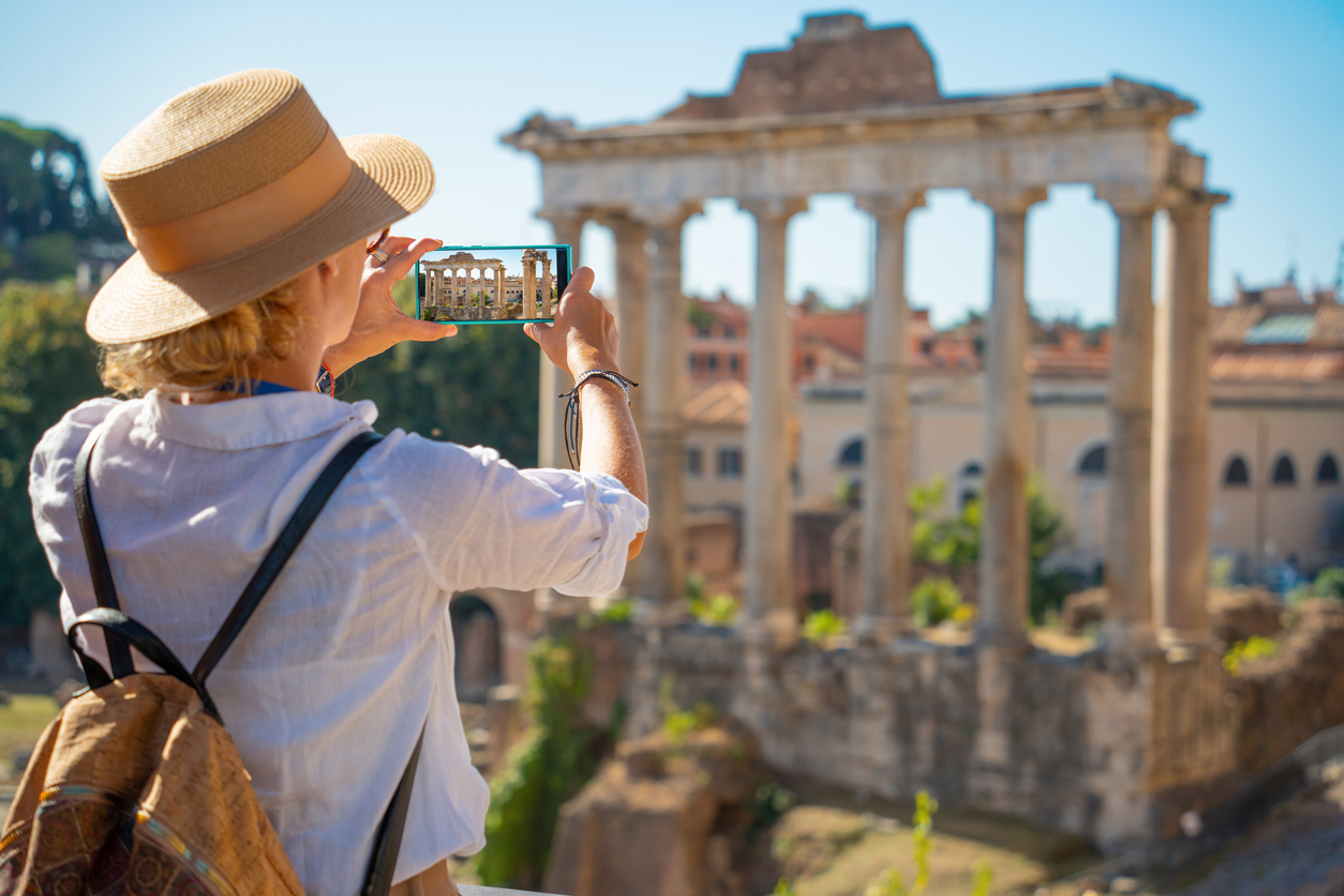 Women at the ruins of the Temple of Saturn in the Roman Forum, Rome, Italy. Photo via iStock photo.