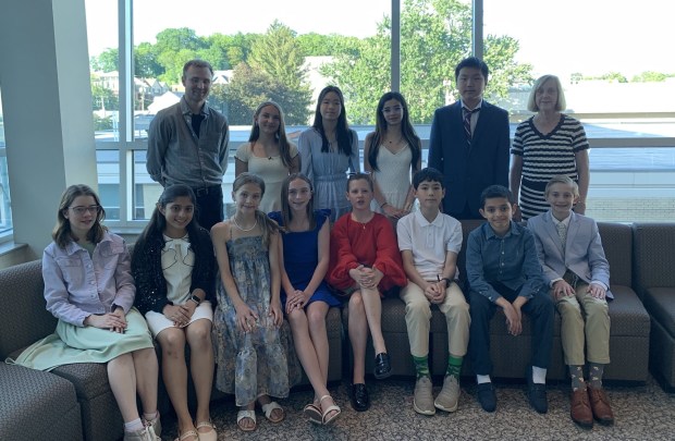 Wyoming Seminary Lower School winners who attended the awards dinner at King's College, first row, from left, are Makayla Mason, Inaaya Nasir, Ella Maakestad, Sadie Flood, Maesy Ellis, John Kern, Faris Mostafa and Ezra Zvirblis. Second row: Monsieur Reitsma, Giovanna Ceruti, Katie Zhang, Azaria Newell, Thomas Lin and Madame Eidam. (SUBMITTED)