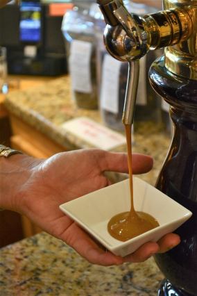 DSC_5722 The Happy Olive in Fairhope has developed a loyal following for its house-blends of olive oils, balsamic vinegars and mustards, which can be purchased by the bottle and jar or on tap. (Karim Shamsi-Basha / Alabama NewsCenter)