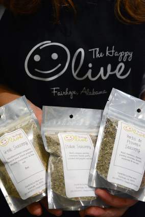 DSC_5749 The Happy Olive in Fairhope has developed a loyal following for its house-blends of olive oils, balsamic vinegars and mustards, which can be purchased by the bottle and jar or on tap. The shop also has its own blend of seasonings. (Karim Shamsi-Basha / Alabama NewsCenter)