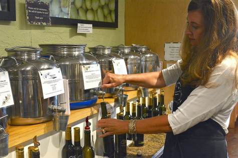 DSC_5753 The Happy Olive in Fairhope has developed a loyal following for its house-blends of olive oils, balsamic vinegars and mustards, which can be purchased by the bottle and jar or on tap. (Karim Shamsi-Basha / Alabama NewsCenter)
