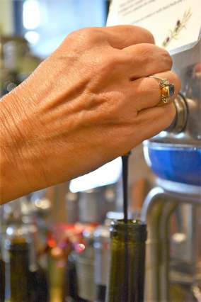 DSC_5765 The Happy Olive in Fairhope has developed a loyal following for its house-blends of olive oils, balsamic vinegars and mustards, which can be purchased by the bottle and jar or on tap. (Karim Shamsi-Basha / Alabama NewsCenter)