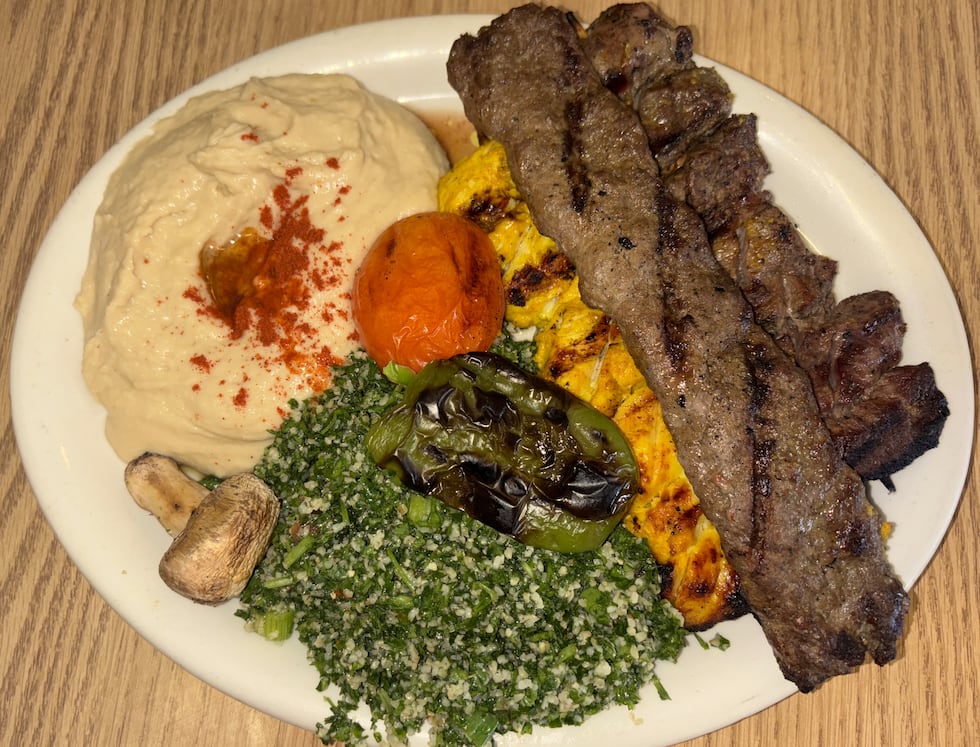 Kabab Mixed plate with chicken, beef, and lamb kababs, hummus and tabooli.