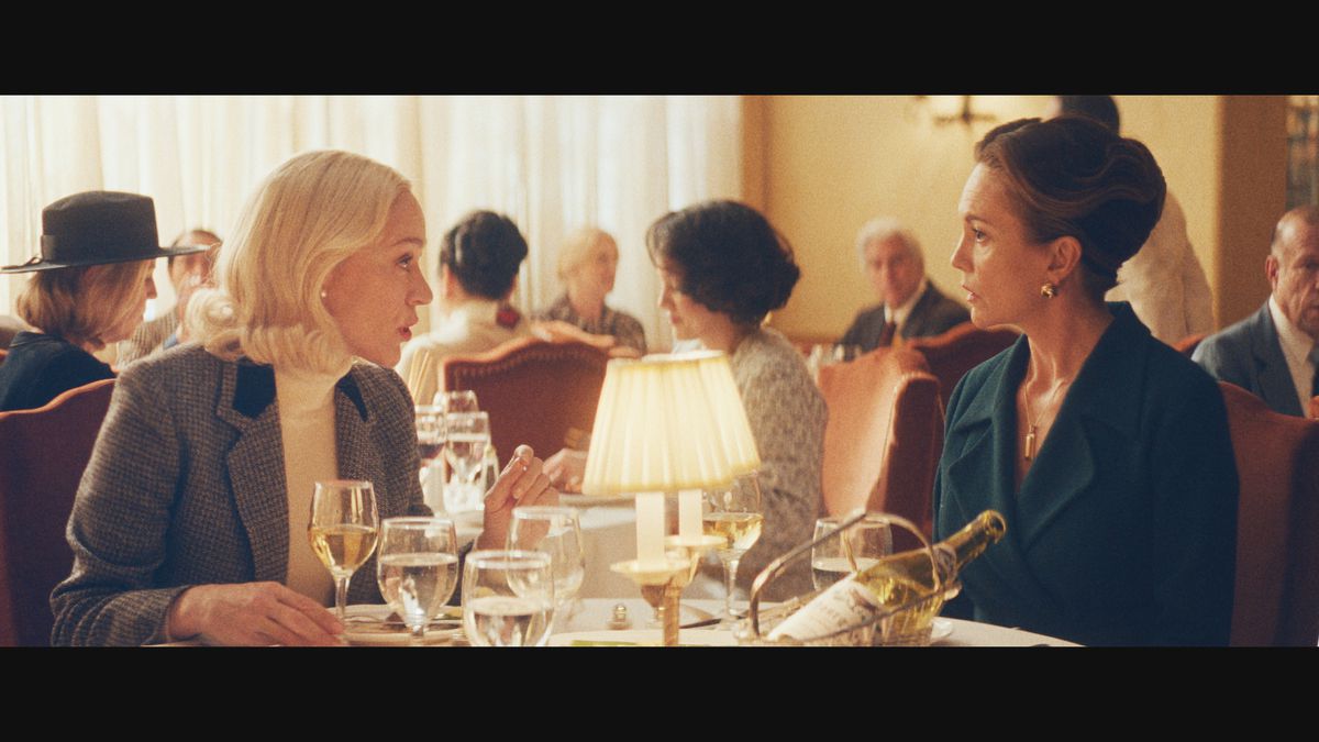 Two women at a restaurant dining table.