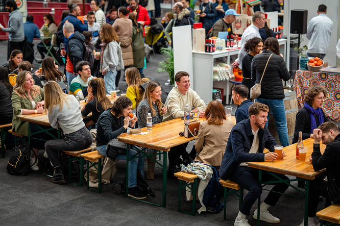 People sat on tables and soaking in the atmosphere at SicilyFEST