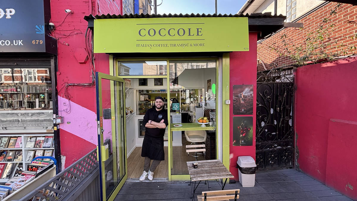Francesco posing in the doorway of the Coccole tiramisu cafe