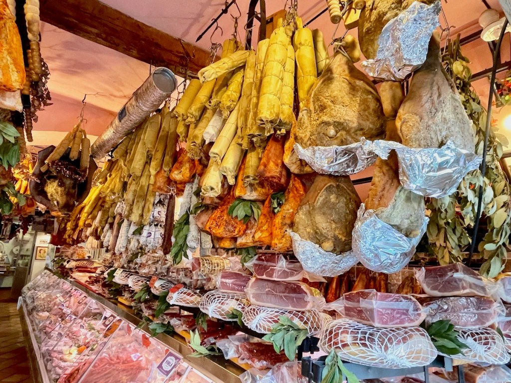 Norcineria Viola 1890 with dozens of hanging meats.