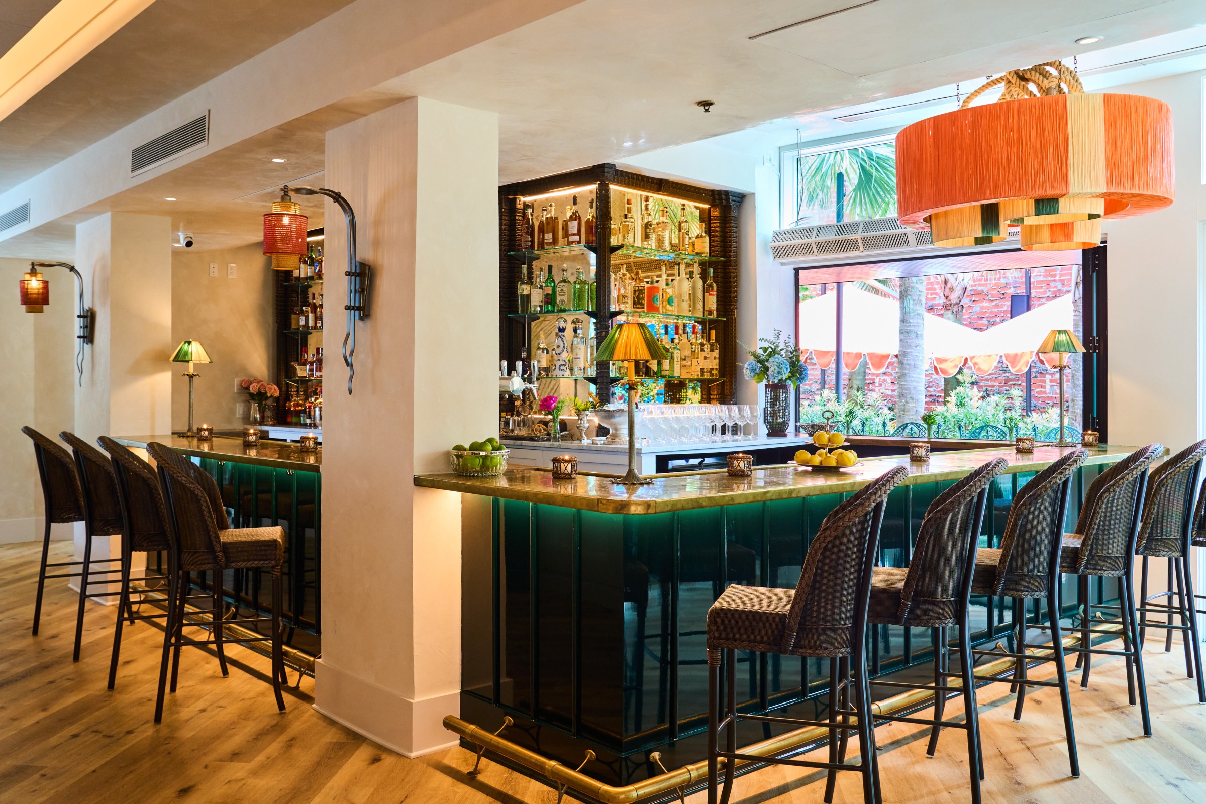 A brass bar with green marble glowing underneath.