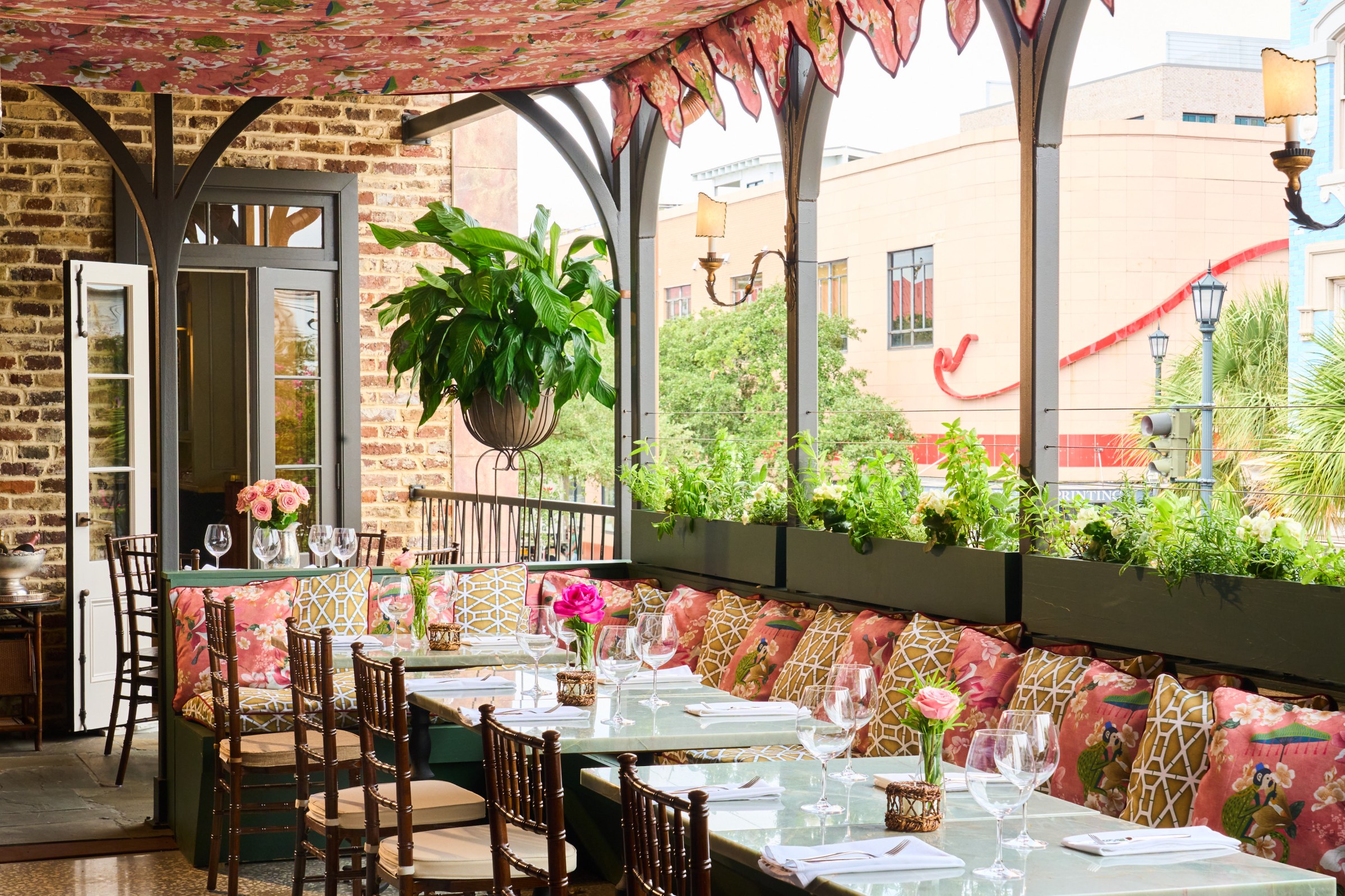 Lush fabrics, imported from Italy, sway over the rooftop dining area.