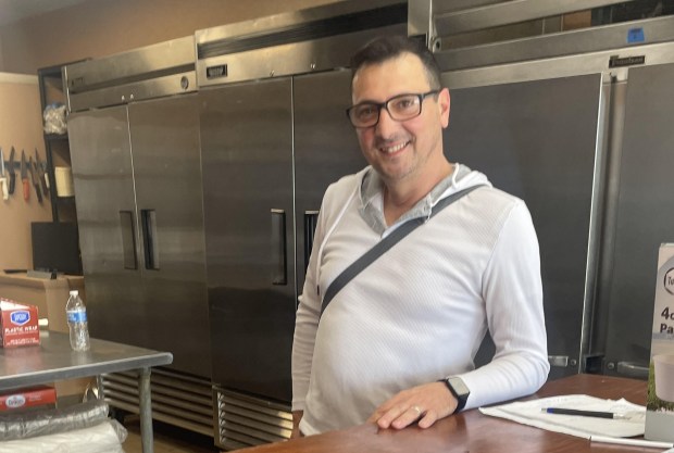 Luca Capoti of Ridley Park is all smiles inside his new takeout/catering restaurant, Luca's Cucina. The new restaurant opens Tuesday, May 2. (PEG DEGRASSA - DAILY TIMES)