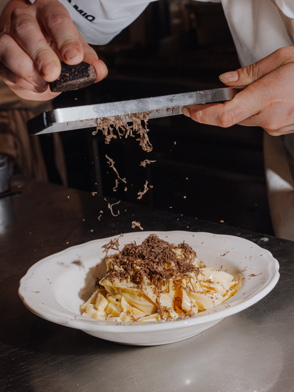 prepping an Italian dish at <yoastmark class=