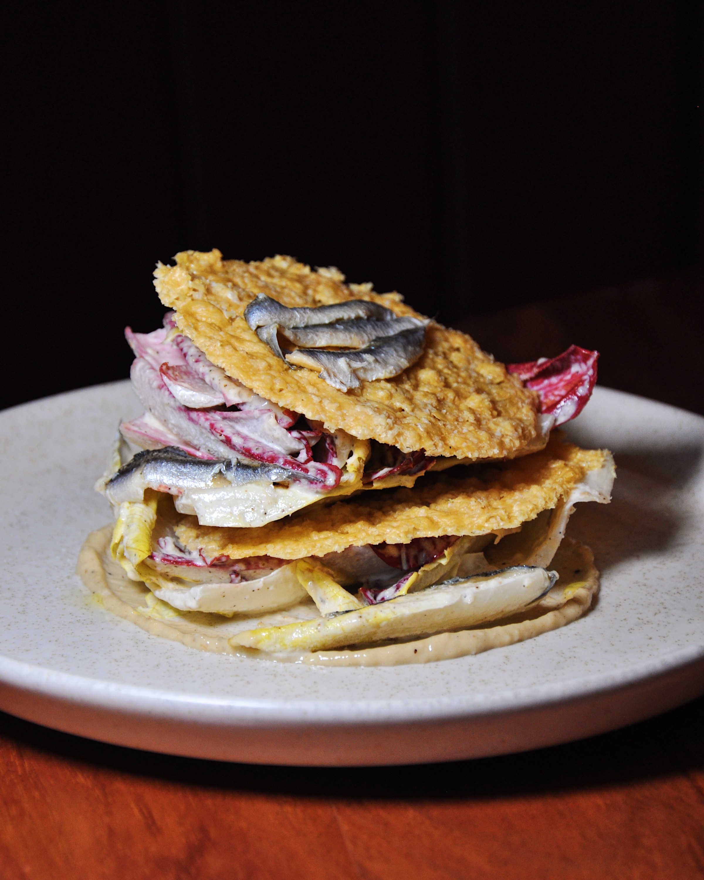 Endive salad with cheese crisps.