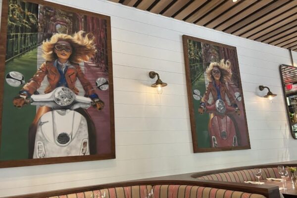 Murals of a woman on a classic Vespa featuring the Italian colors of red, white and green were commissioned by Sector Seventeen, a local Boise art collective. (PHOTO: STEVE LOMBARD, IBR)