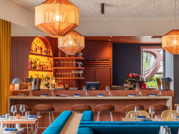 the dining room at Nico filled with terracotta and rich blue hues