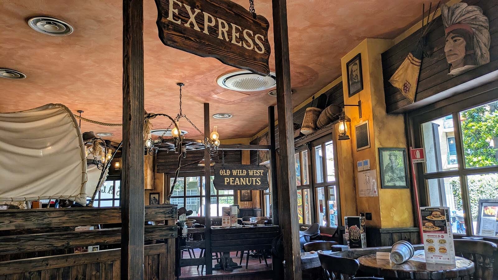 The inside of the restaurants tends toward the kitschy, with a saloon-like feel and a jumble of various Western-themed art.