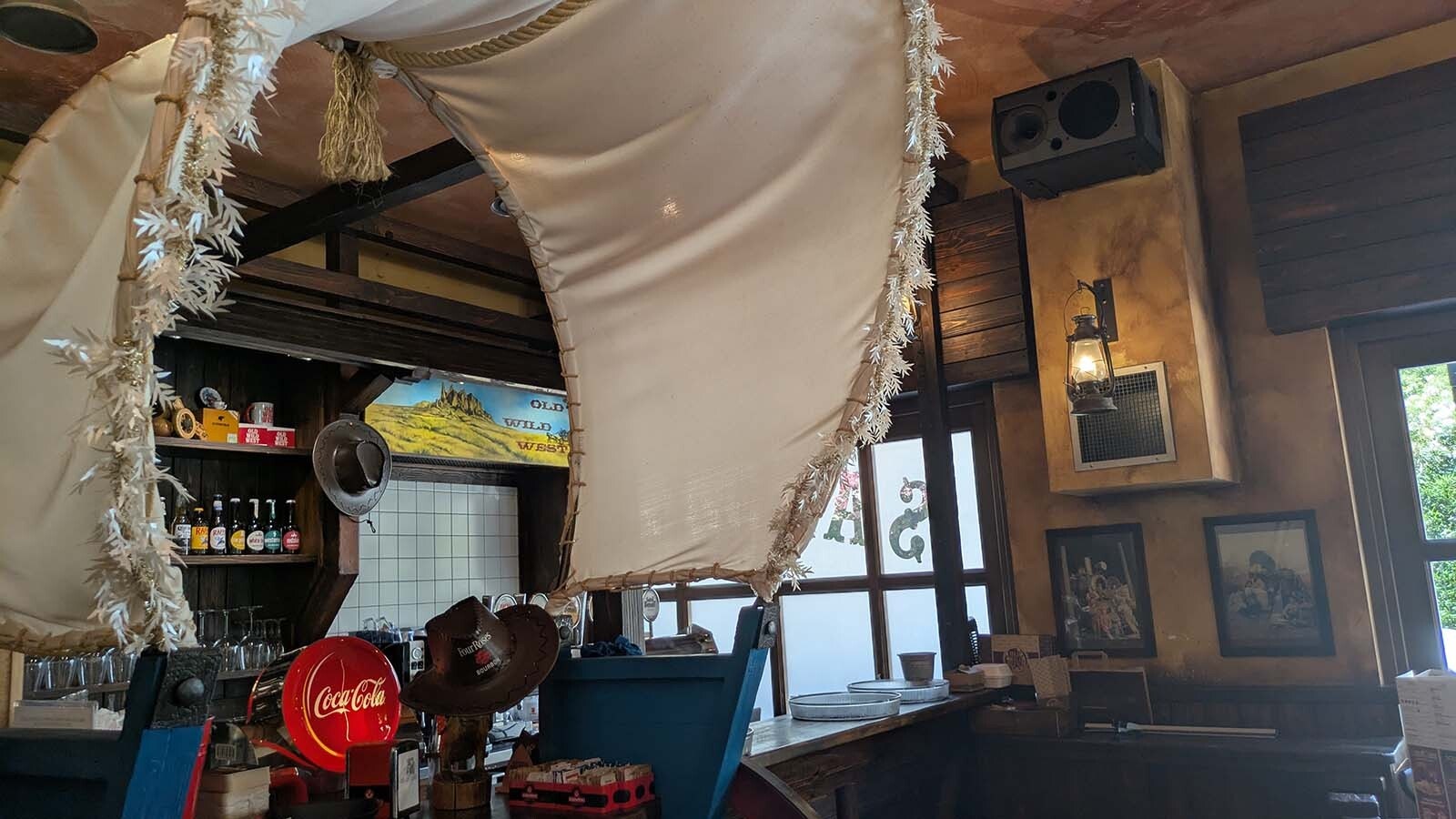 The inside of the restaurants tends toward the kitschy, with a saloon-like feel and a jumble of various Western-themed art.