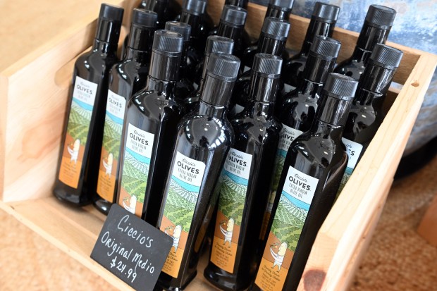 A display rack of olive oil at Ciccio's Olives at 12B S. Fifth Ave., West Reading. (BILL UHRICH/MEDIANEWS GROUP)
