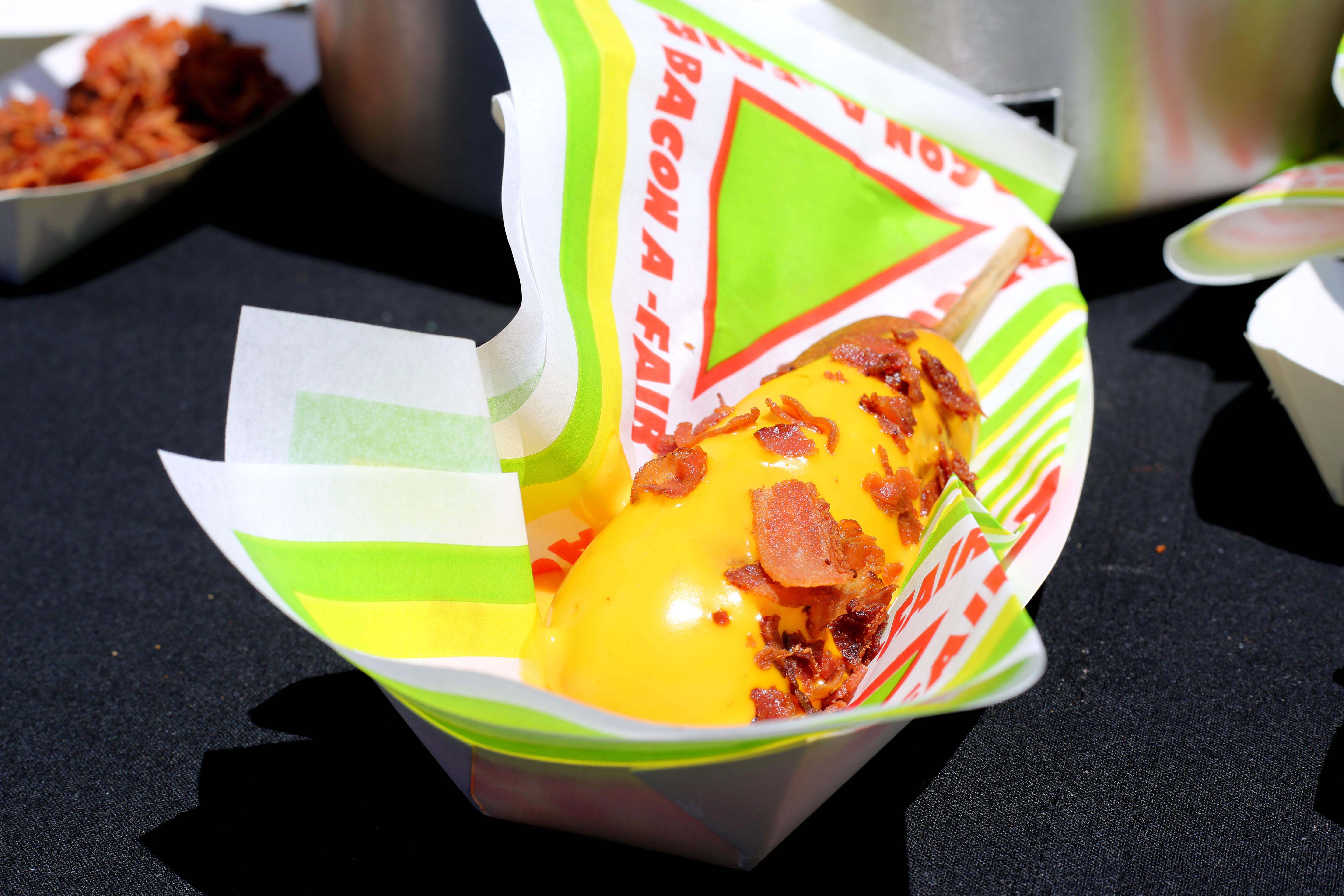 Bacon A-Fair's Macho Bacho Bacon Unicorn Dog: a corn dog dipped in nacho cheese, topped with bacon crumbles. They also have a Unicorn Party Pineapple, a Fireball-infused pineapple slice topped with bacon.