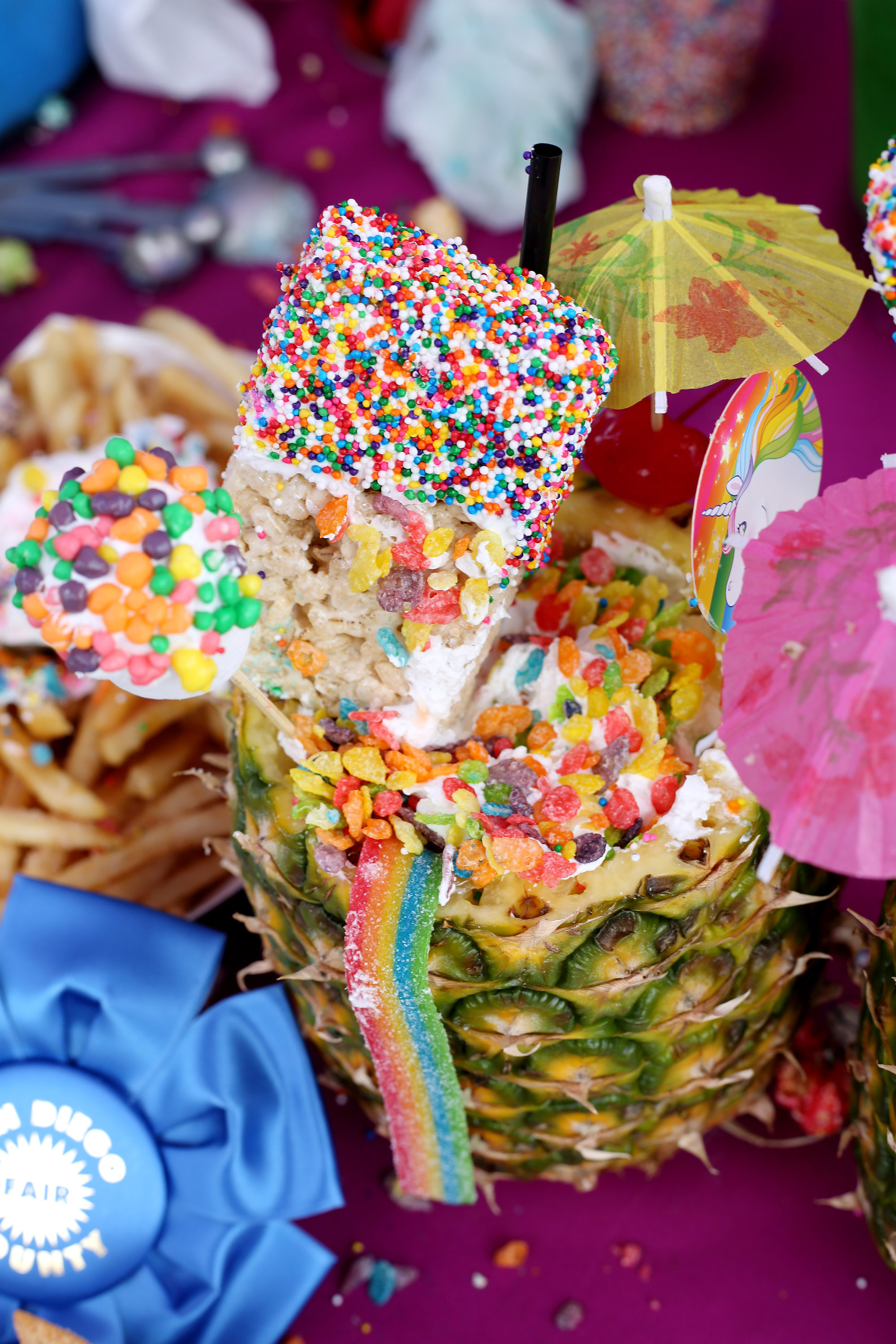 Who doesn't love a rainbow shake? Check out this awesome shake, all stacked into a pineapple.