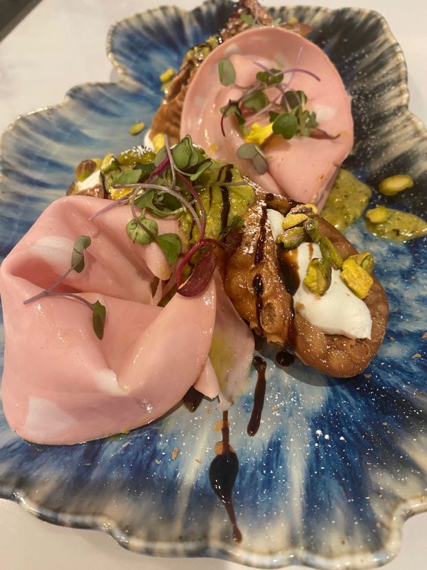Chef Marcello Zasso has created two appetizers that will be available only at the Locanda in Willow Glen. This savory dish, called Broken Cannolo. features cannoli shells with fresh ricotta, mortadella, .pistachio cream and pistachios and will be added soon to the menu. Linda Zavoral - Staff