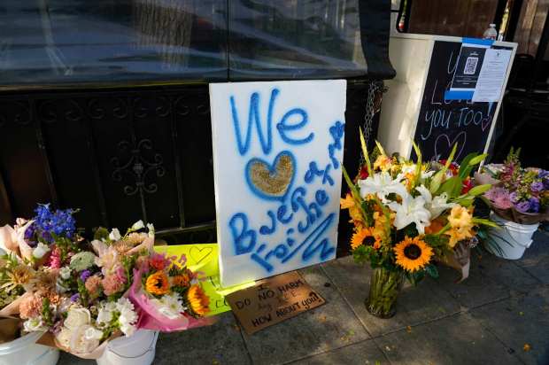 Buona Forchetta restaurant posted a message announcing all its San Diego and Orange County locations would be closed Monday and Tuesday after at least three workers were detained by immigration officers in a surprise raid Friday. Flowers and signs out front of the restaurant in South Park on 06.02.25, in San Diego, California. (Alejandro Tamayo / The San Diego Union-Tribune)