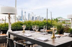 The outside seating area, with a view of Manhattan, at The Feathered Fox in Jersey City