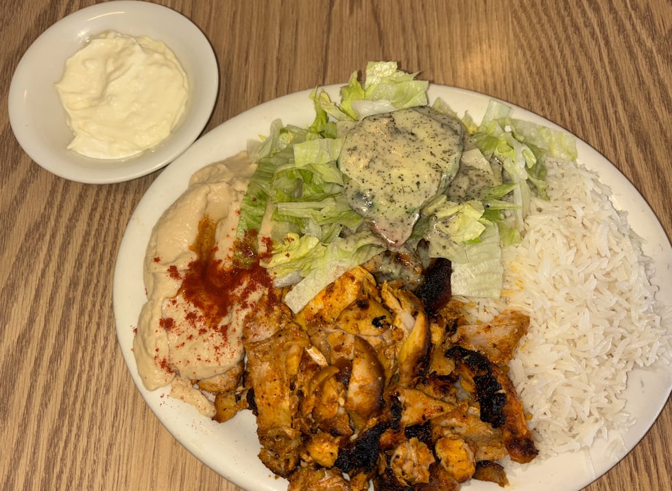Chicken Shawarma plate served with grilled, marinated chicken, rice, hummus, salad and a side...