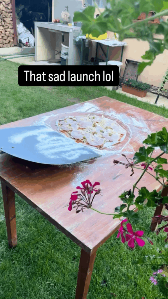 at putting the pizza in the oven