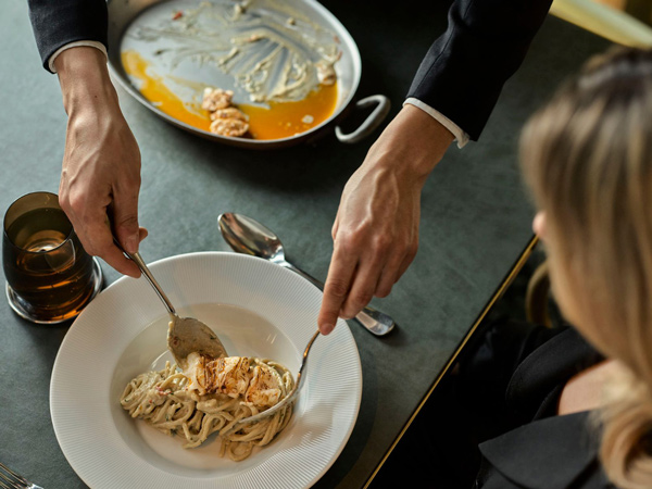 serving pasta at a'mare, sydney