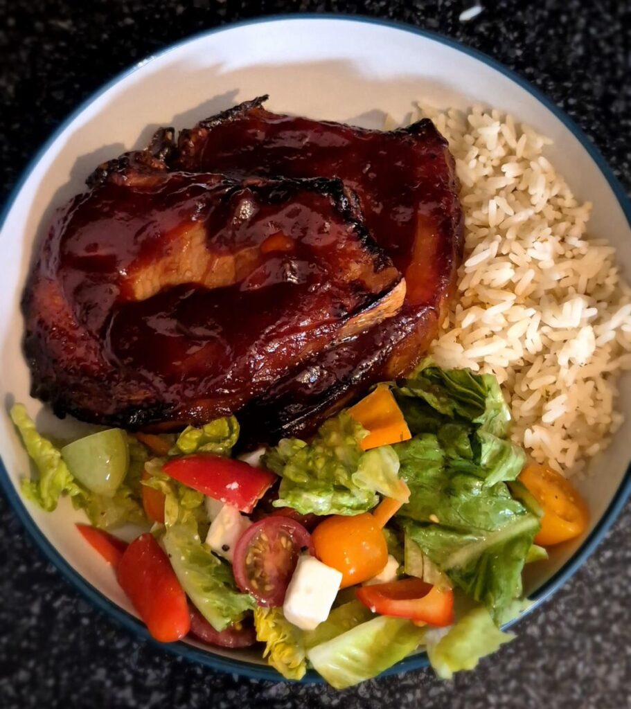 BBQ pork chops, rice and a mixed salad with vinaigrette
