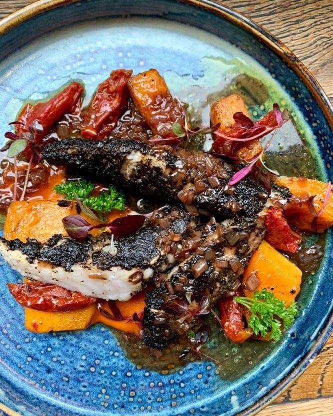 A lovely plate of food with a salad garnish served at Blanchette restaurant in Soho