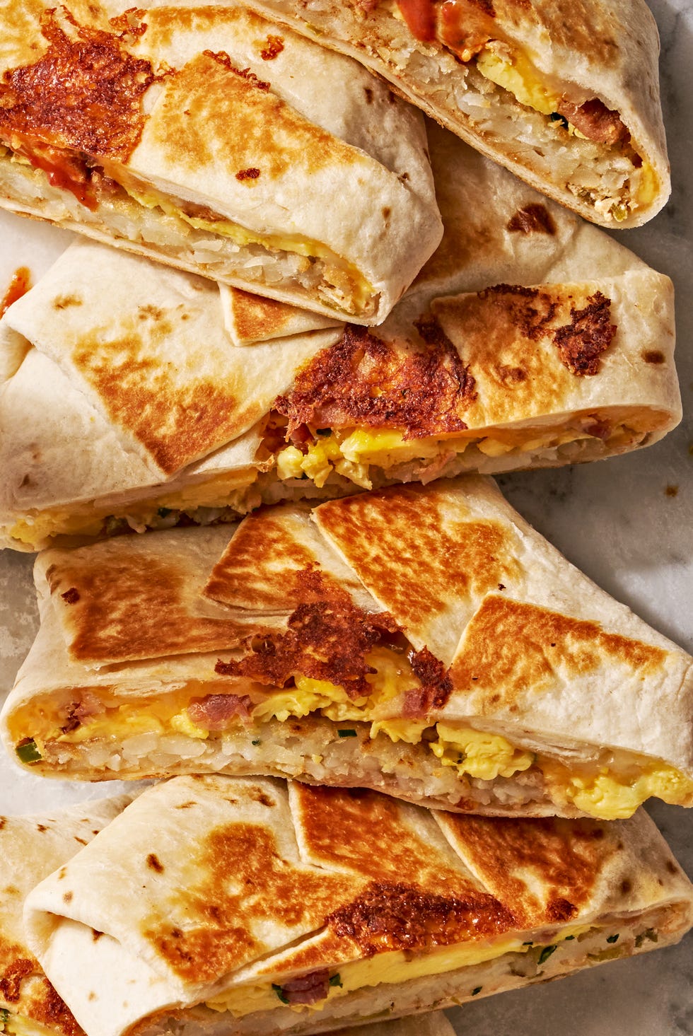 crunchwrap layered with eggs, hashbrowns, and bacon