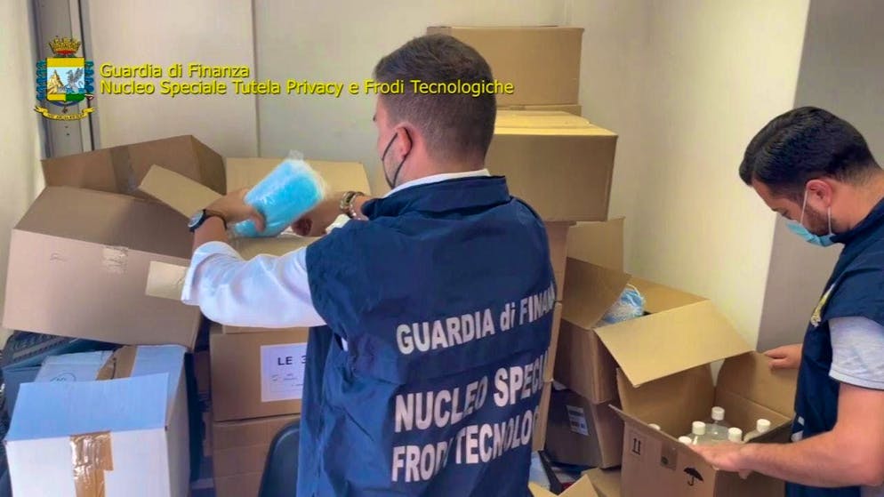 Italian investigators search parcels.