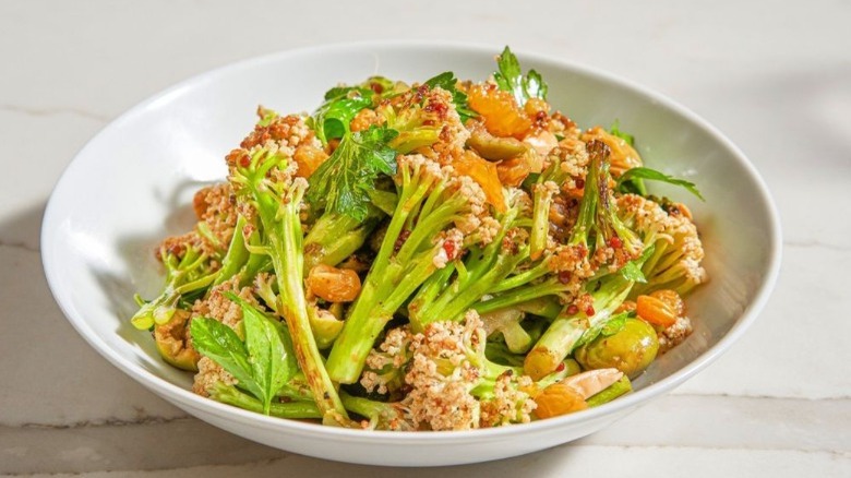 sprouted cauliflower with castelvetrano olives, marcona almonds, oranges, and golden raisins.