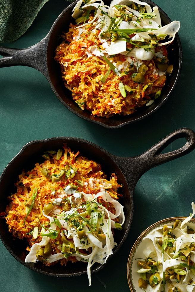 crispy skillet carrot latkes in a cast iron pans